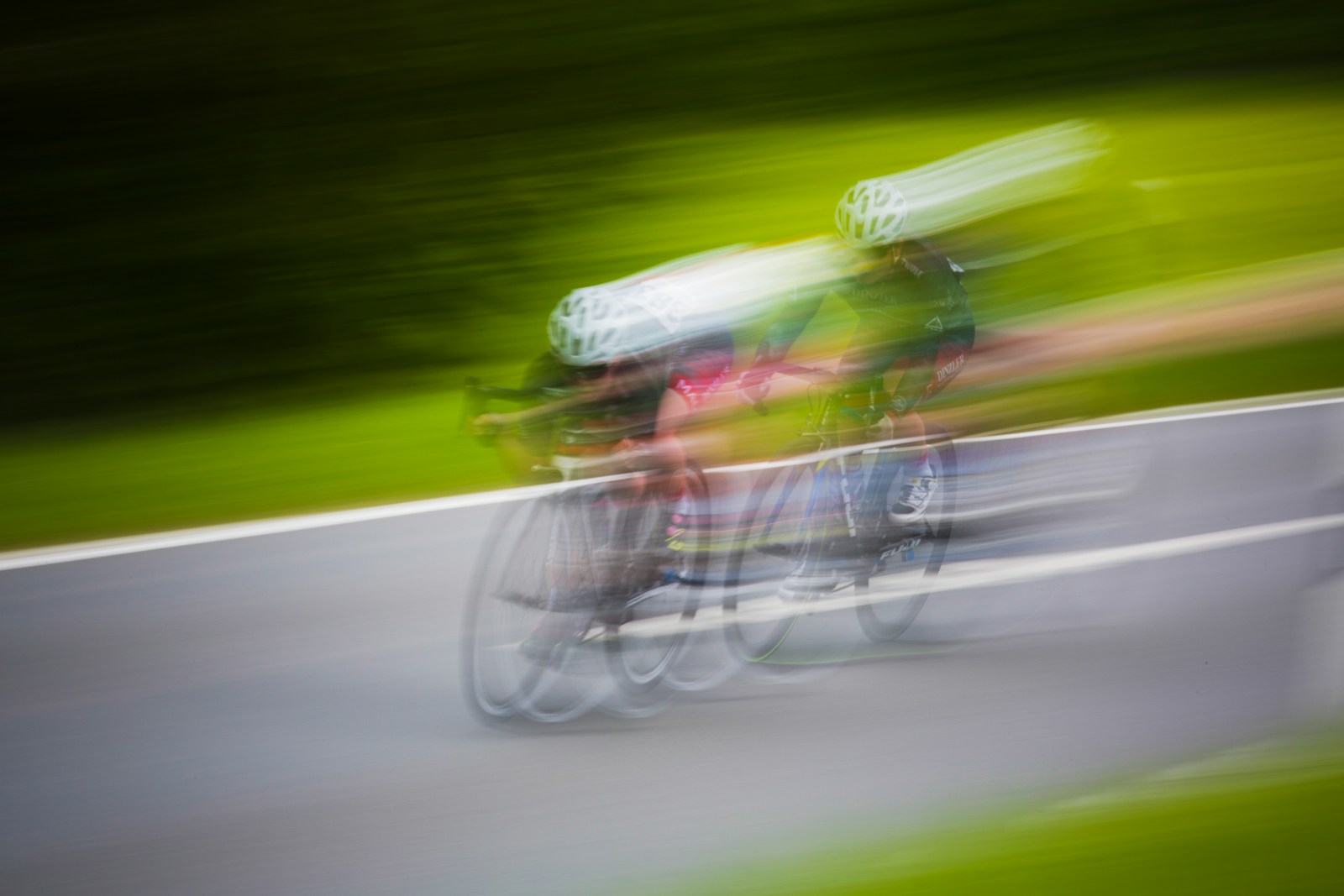 Two cyclists race on road
