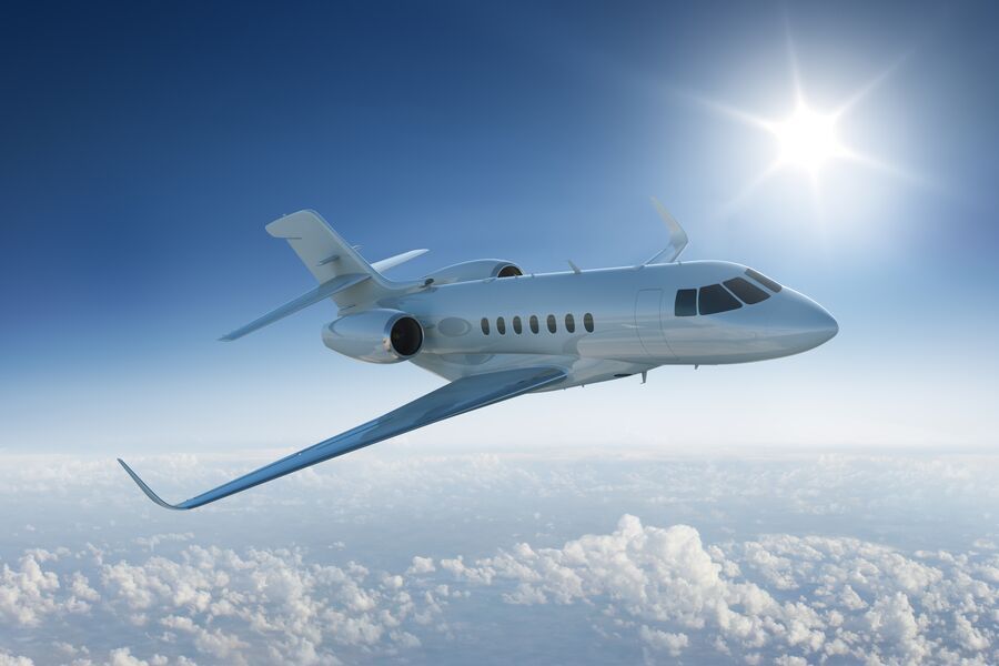 Private-jet-flies-past-sun-GettyImages-466619660-Med