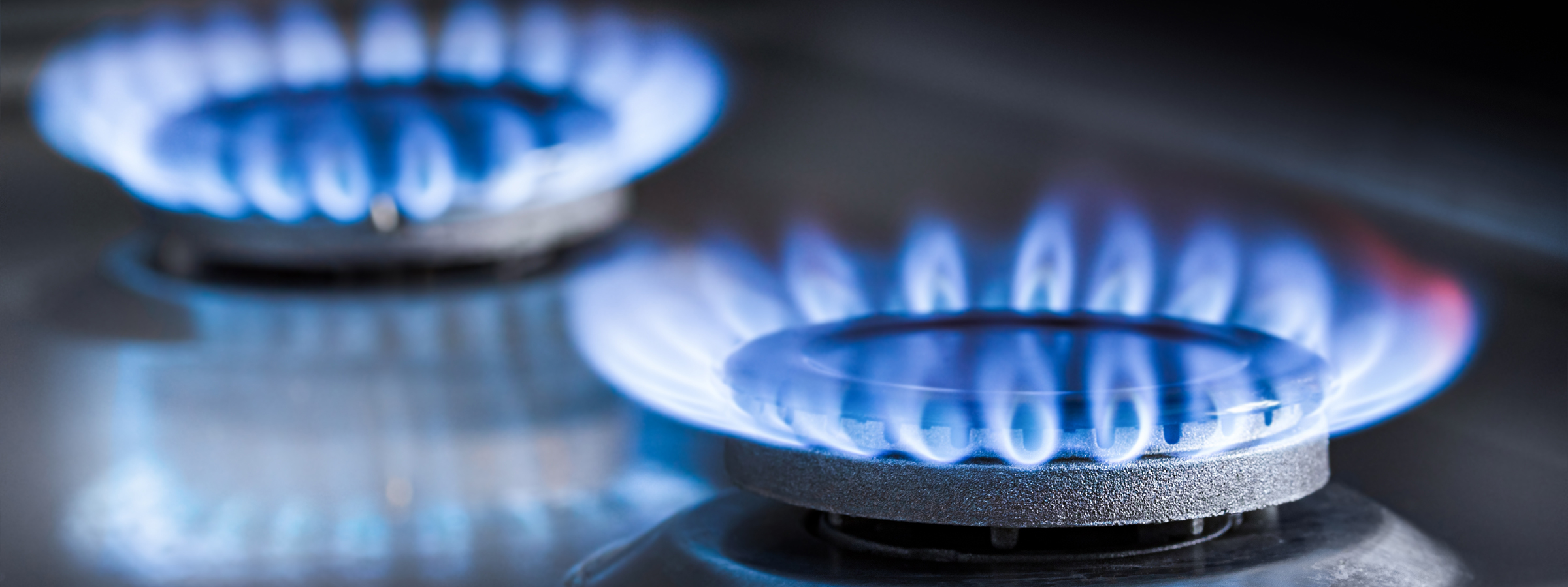 Two,Burning,Gas,Burners,On,A,Kitchen,Gas,Stove