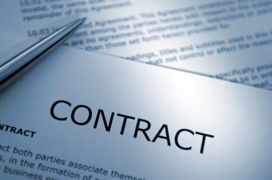 Contract-header-with-pen-GettyImages-157382588-Med (1)