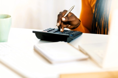 Small Person Using Calculator
