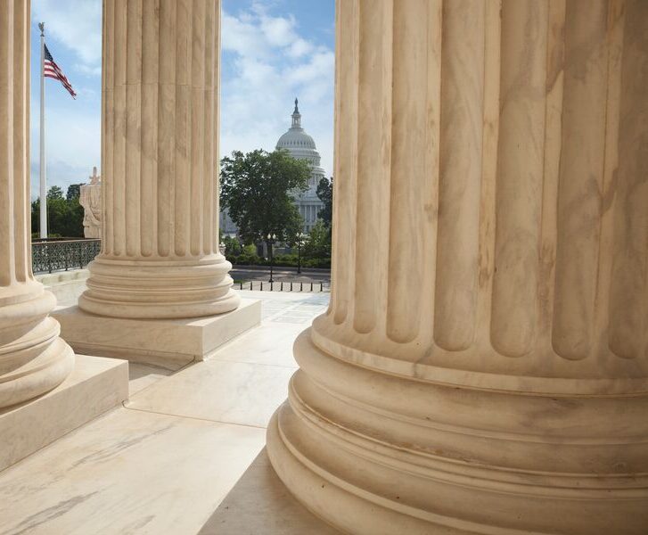 Supreme-Court-columns-with-American-GettyImages-621474914-Med