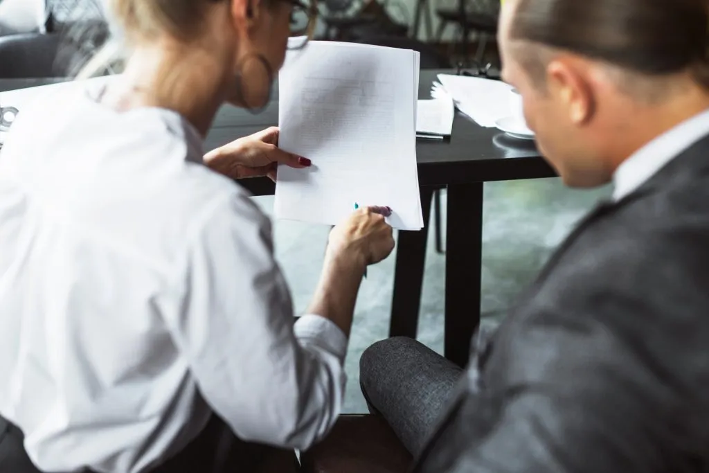 Two people looking at documents