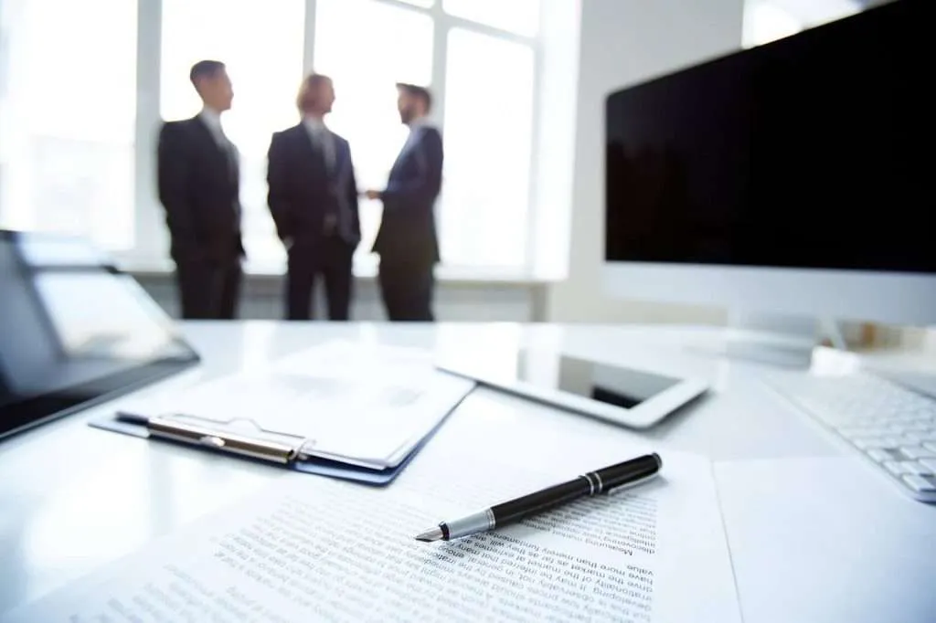 Three colleagues discussing a legal issue