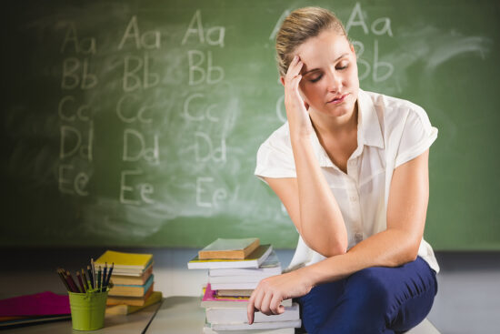 https-www-njemploymentlawfirmblog-com-files-2025-06-bigstock-tensed-school-teacher-sitting-139644923-jpg