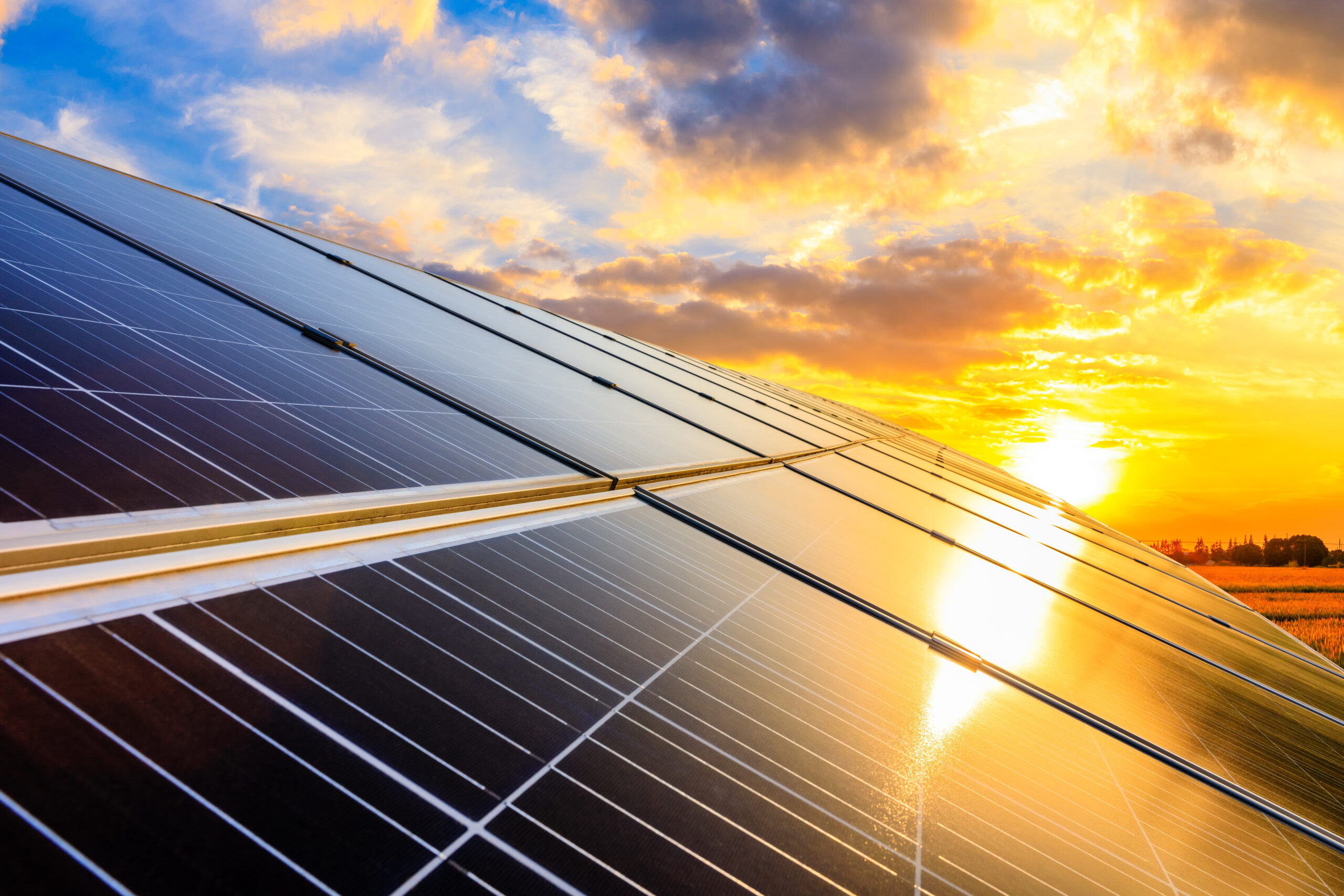 Photovoltaic solar panels on sunset sky background,green clean e
