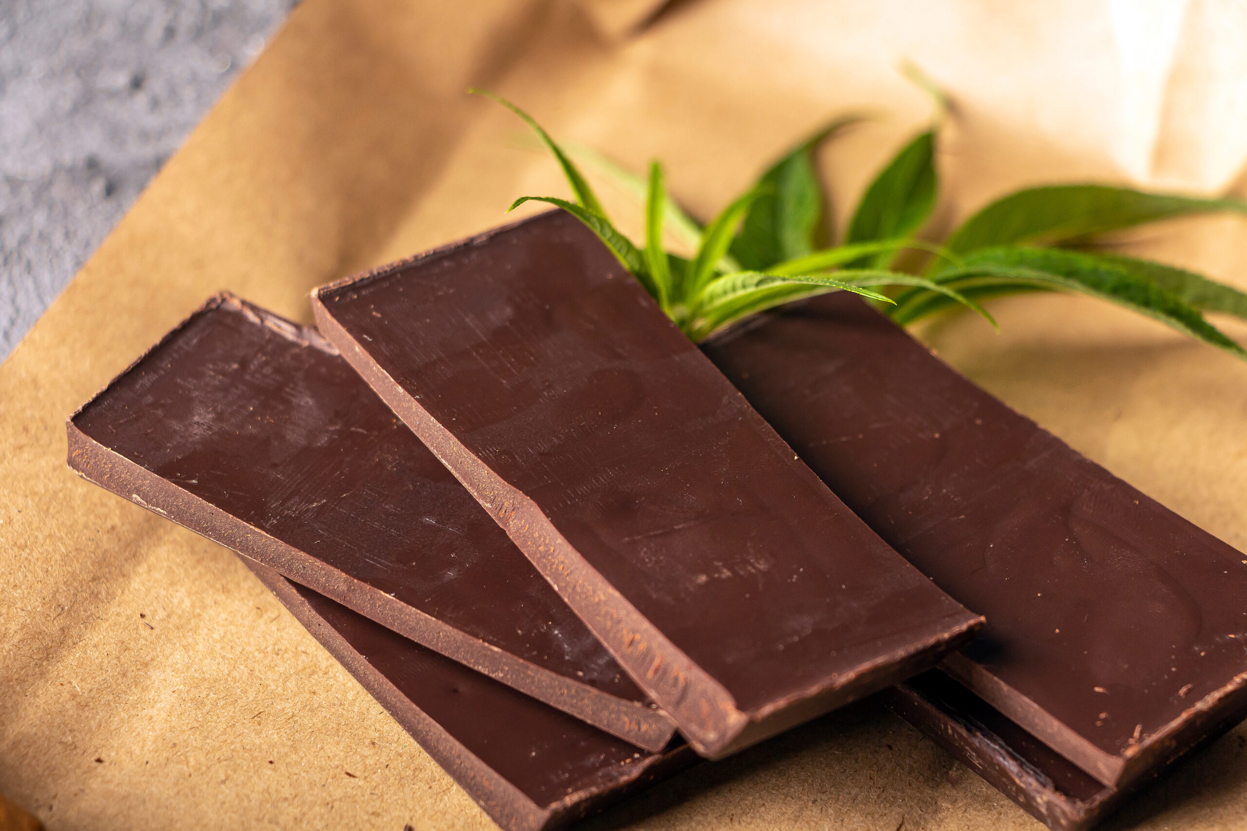 Vegan dark  chocolate with cannabis leaves. Desert with CBD butter. Medicinal marijuana in food, vegan, supplements consept