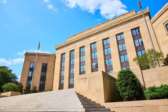 Tennessee State Office Building with American Flag Upward Perspective