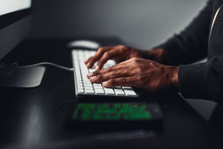 Hands-typing-on-computer-side-view-GettyImages-904449080-Sm
