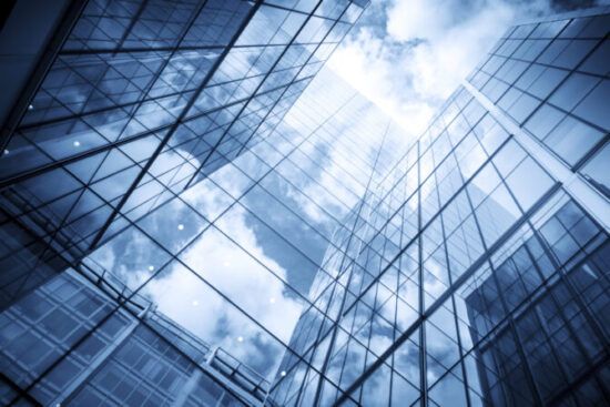 skyscraper reflecting the blue sky and clouds