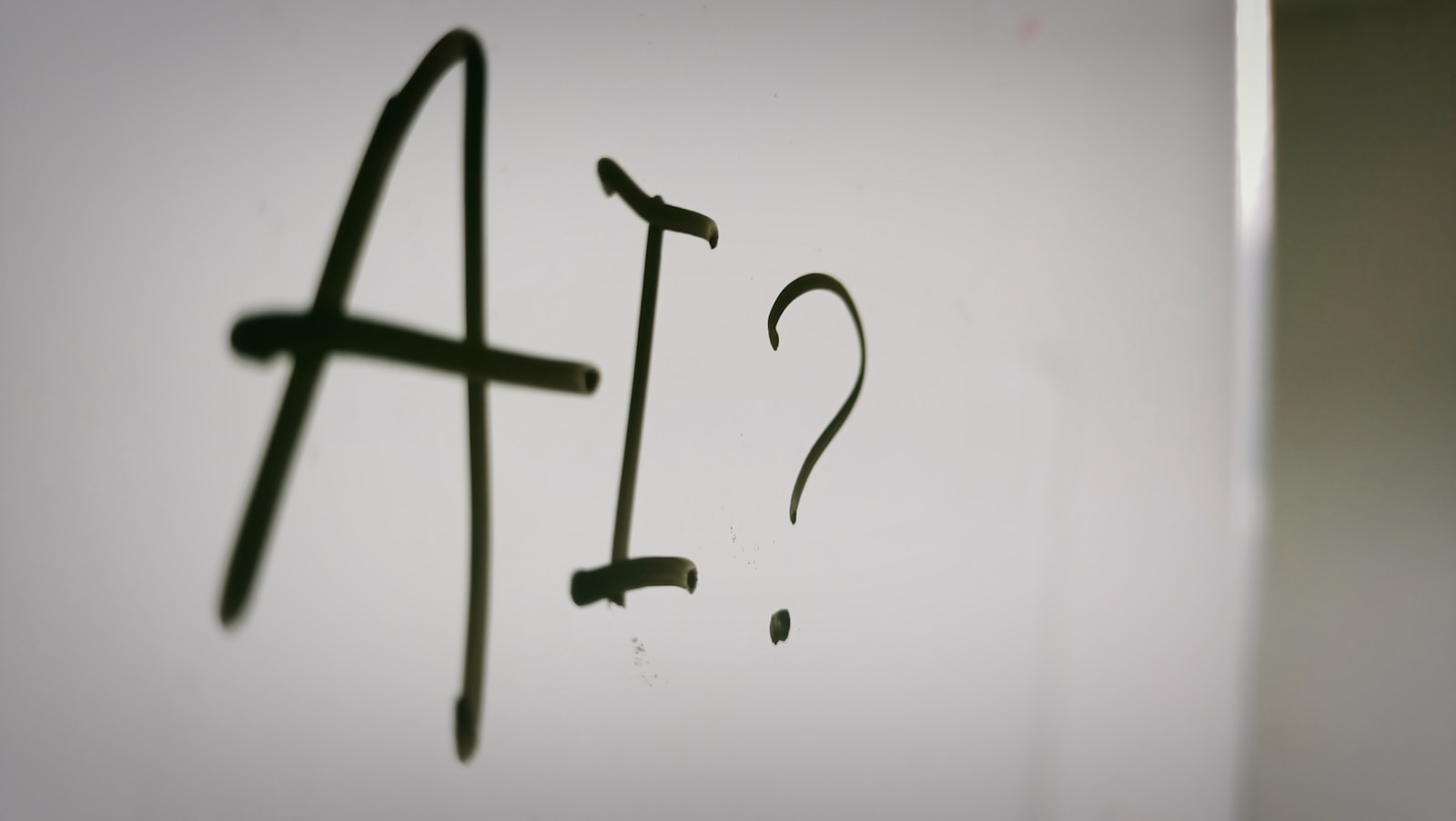 The word "AI" written on whiteboard.