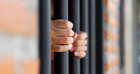 https-www-wislawnow-com-files-2025-07-jail-prison-bars-hands-1200x630-1-jpg