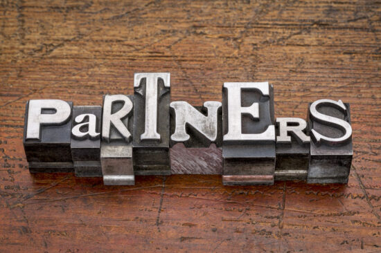 partners word in metal type