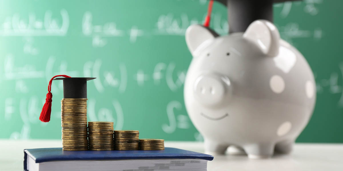 Scholarship concept. Coins, graduation cap and book on light grey table, space for text