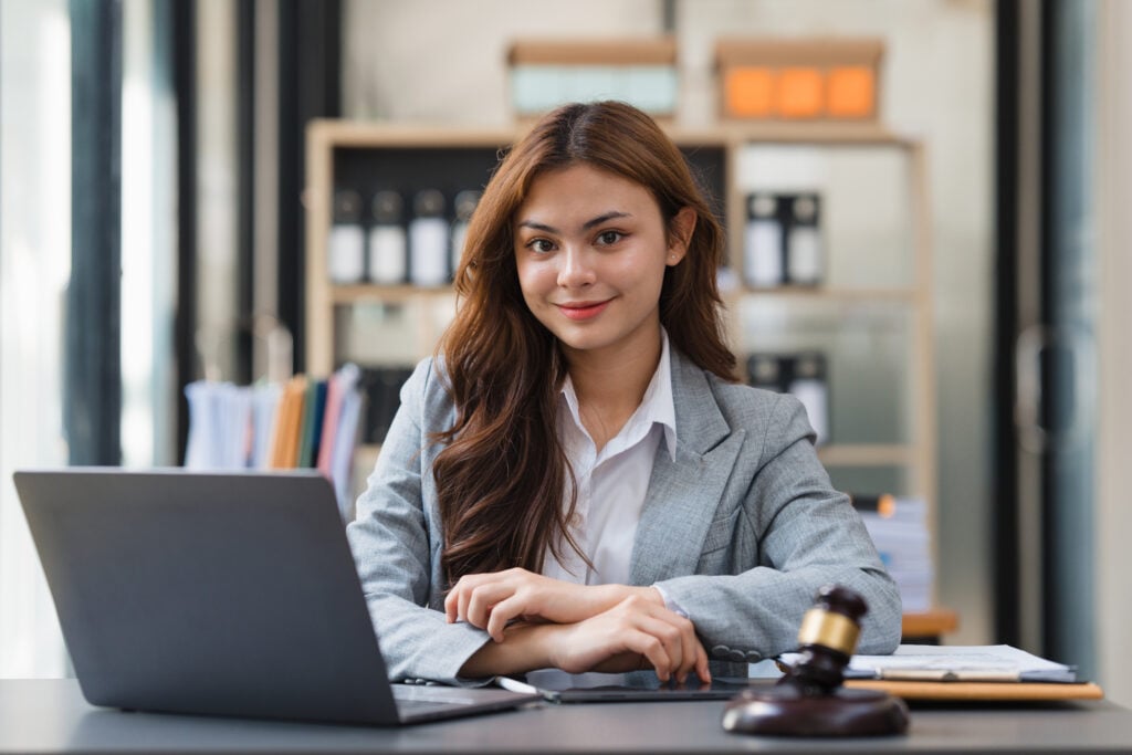 2024 law school graduates employment rate Business Lawyer consulting online on laptop while working at office..