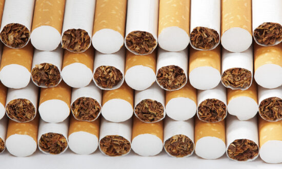 Pile stacked cigarettes against a white background.