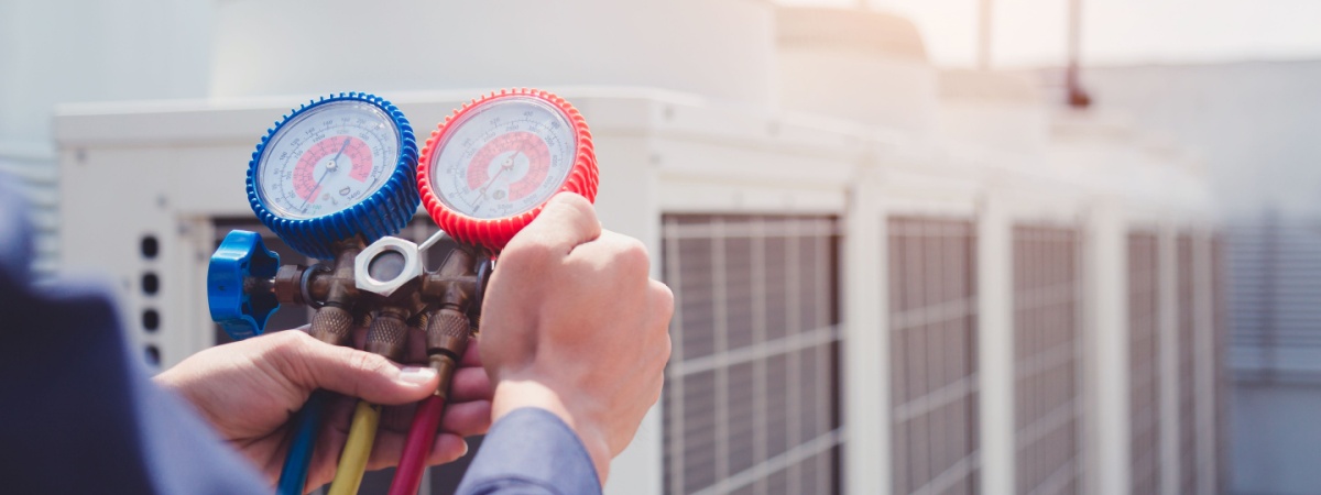 technician checking air conditioner