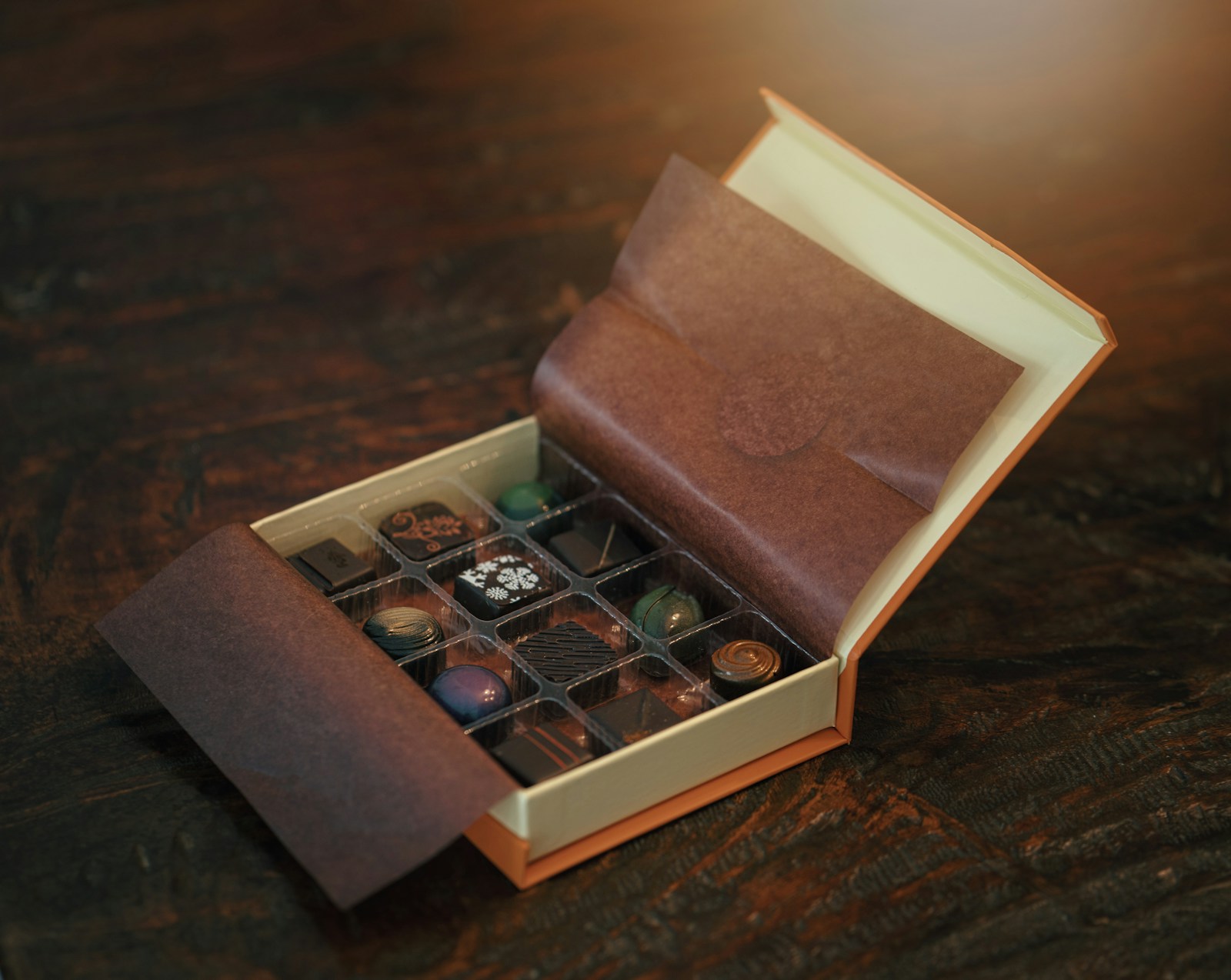 Box of gourmet chocolates sitting on a table