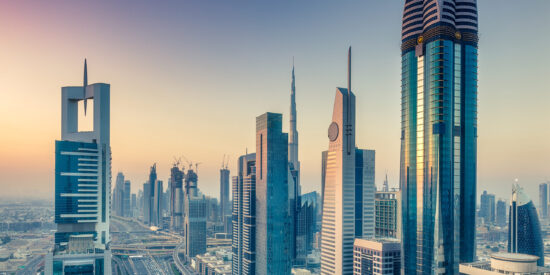 Skyscrapers and highways of downtown Dubai, United Arab Emirates, at sunset