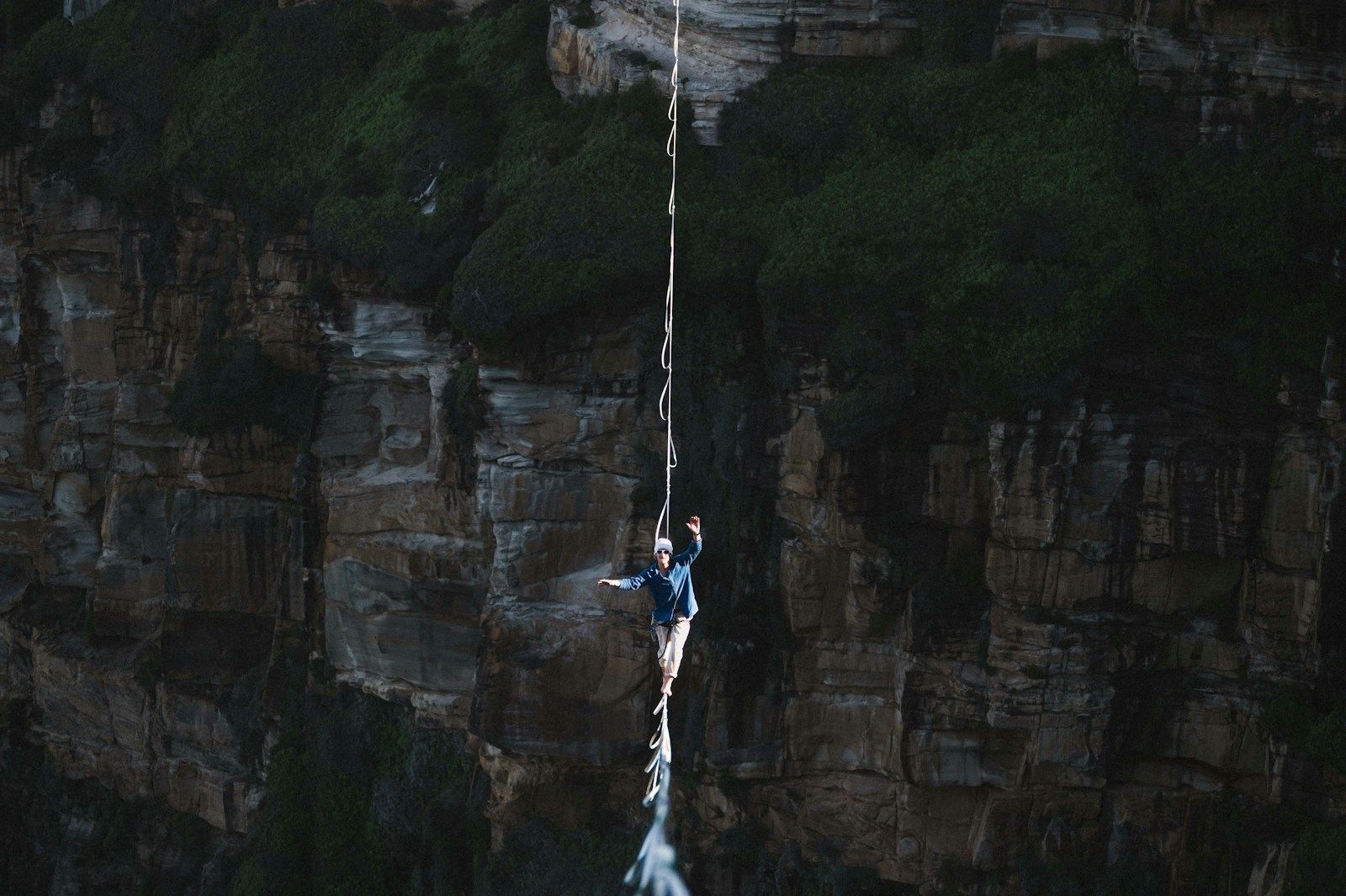 Battling gravity and his mind as he crosses a 150m long highline.