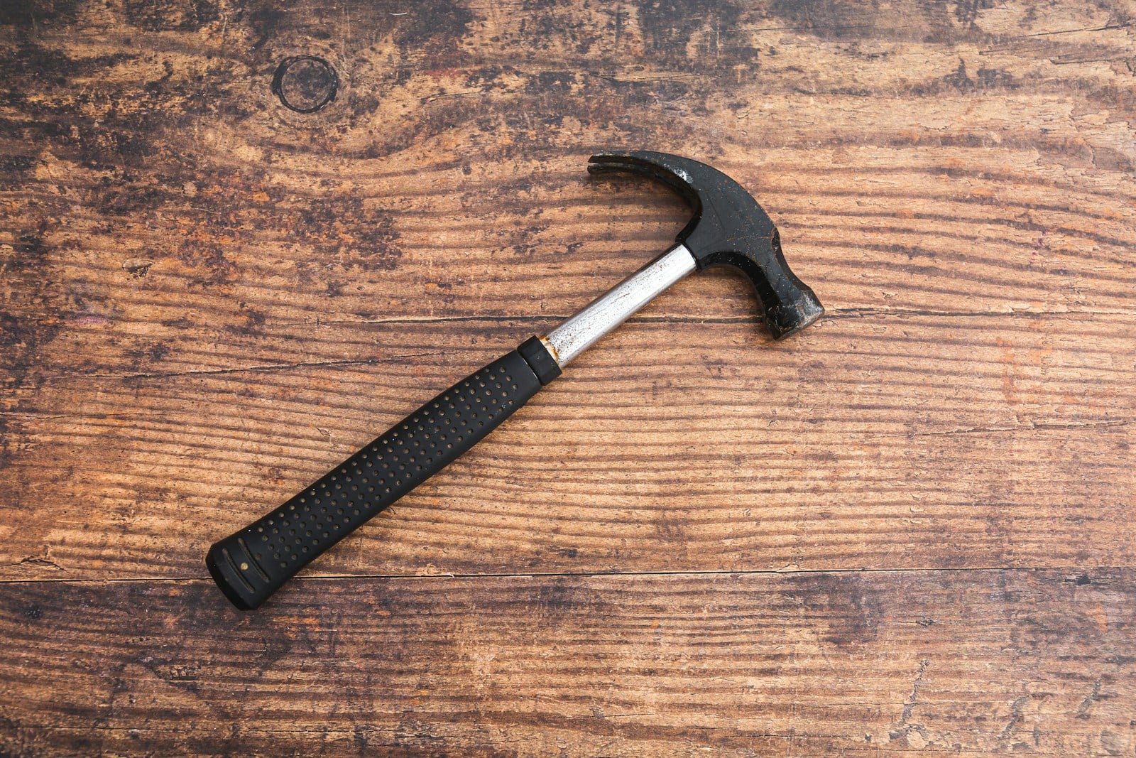 Tools on a table. Hammer on a workbench