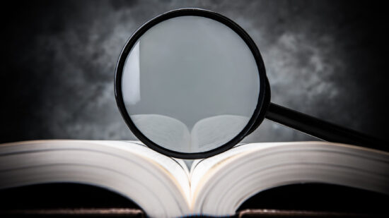 magnifying glass on the book