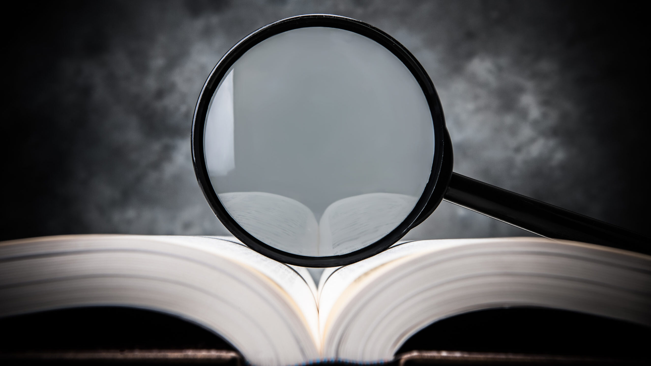 magnifying glass on the book