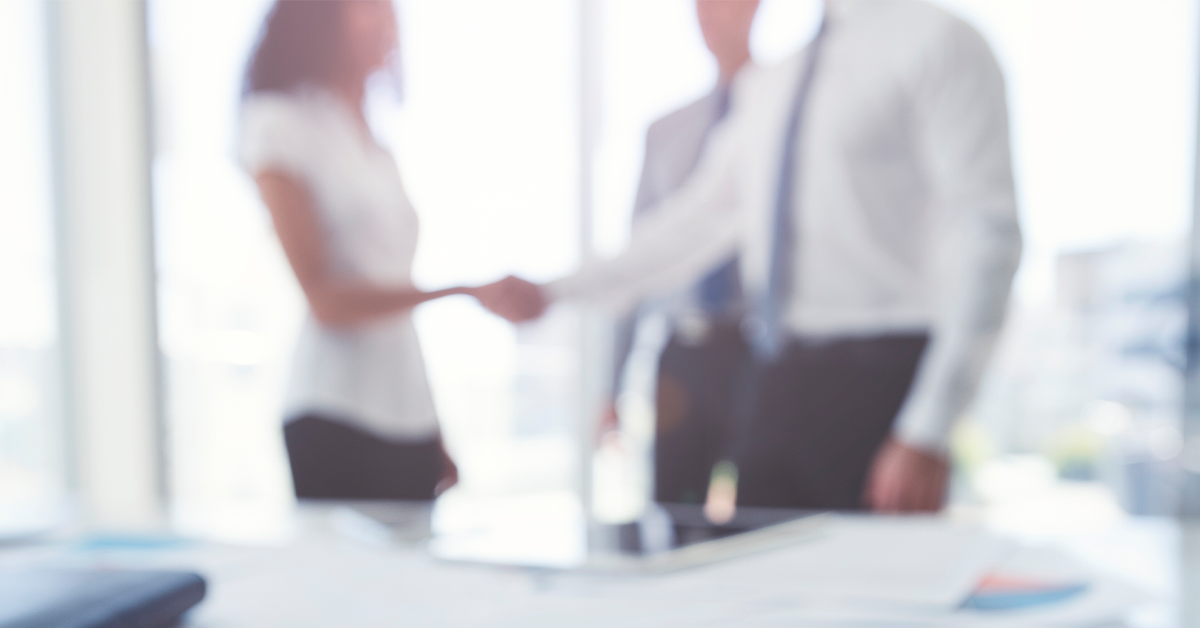 woman and man shaking hands