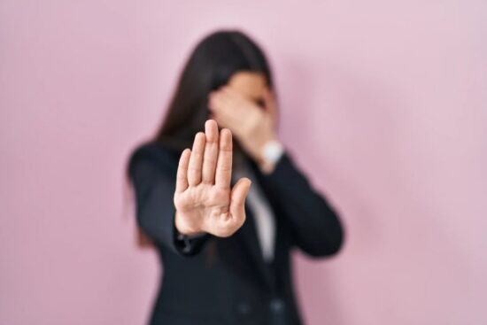 https-i0-wp-com-llbmania-com-wp-content-uploads-2026-03-young-brunette-woman-wearing-business-style-pink-background-covering-eyes-with-hands-doing-stop-gesture-with-sad-fear-expression-embarrassed-n