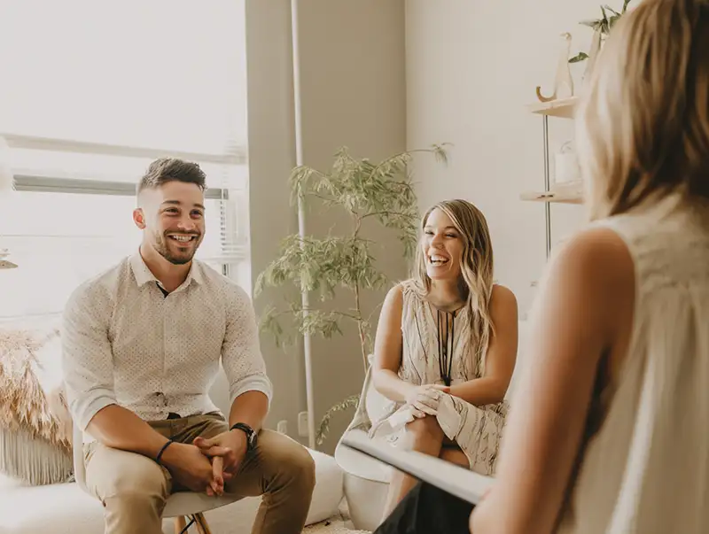 Happy couple consulting Jimenez Law