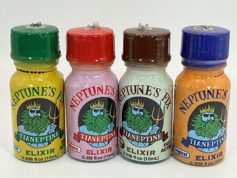 image of 4 tianeptine bottles, green, red, brown, and blue
