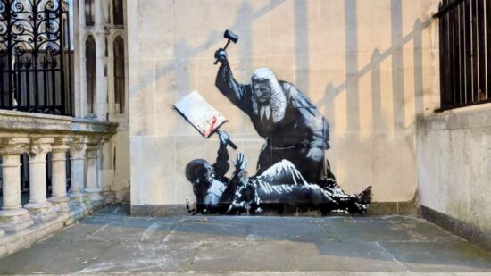 https-i0-wp-com-criticallegalthinking-com-wp-content-uploads-2026-05-banksy-new-mural-royal-courts-of-justice-london-peaceful-protester-violence-palestine-action-uk-image-marrosi-5-1-jpgresize800%