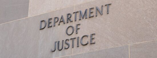 Sign at the United States Department of Justice DOJ in Washington, DC-Shutterstock_2262073553