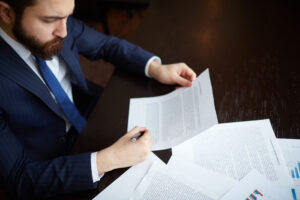 https-kirakosianlaw-com-wp-content-uploads-2026-04-confident-entrepreneur-reviewing-contract-300x200-jpg