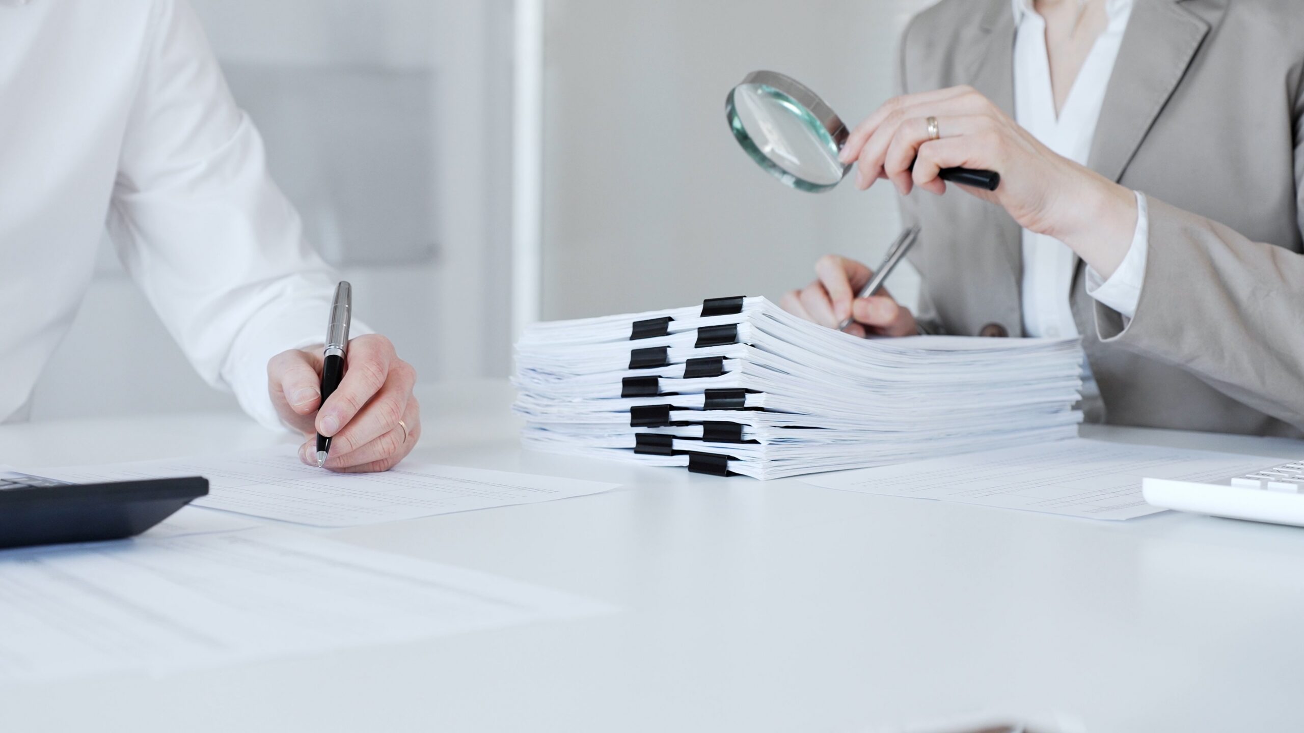 Auditors,And,Financial,Experts,Analyzing,Tax,Documents,,Reviewing,Contract,Papers,