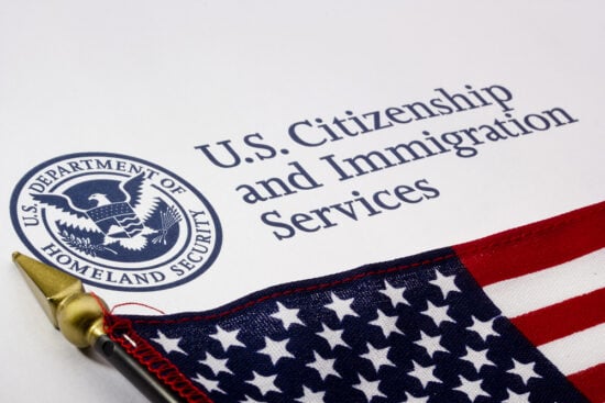 USCIS with flag