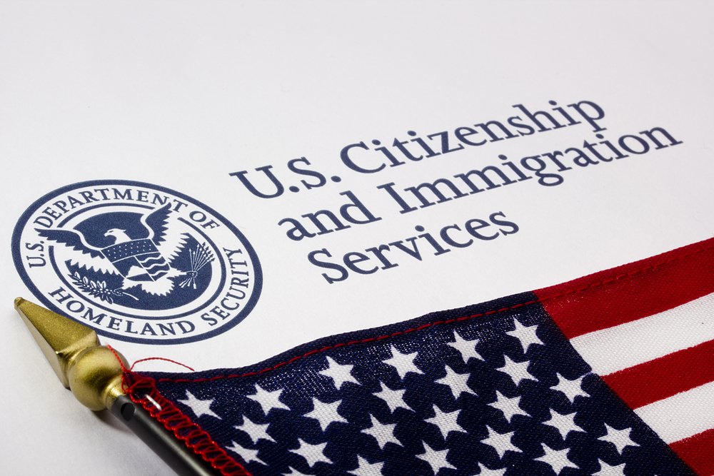 USCIS with flag
