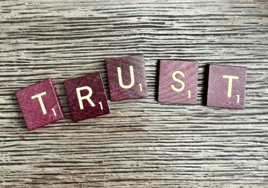 scrabble tiles spelling trust