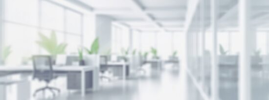 Blurred empty open space office-Shutterstock_2321309325