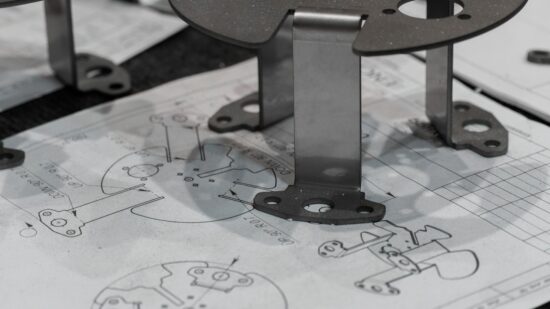 Every detail matters. A manufactured component is verified against its original schematics, ensuring perfect adherence to the design intent. https://www.encata.net/services/mechanical-engineering-services?utm_source=unsplash&utm_medium=organic&utm_content=image