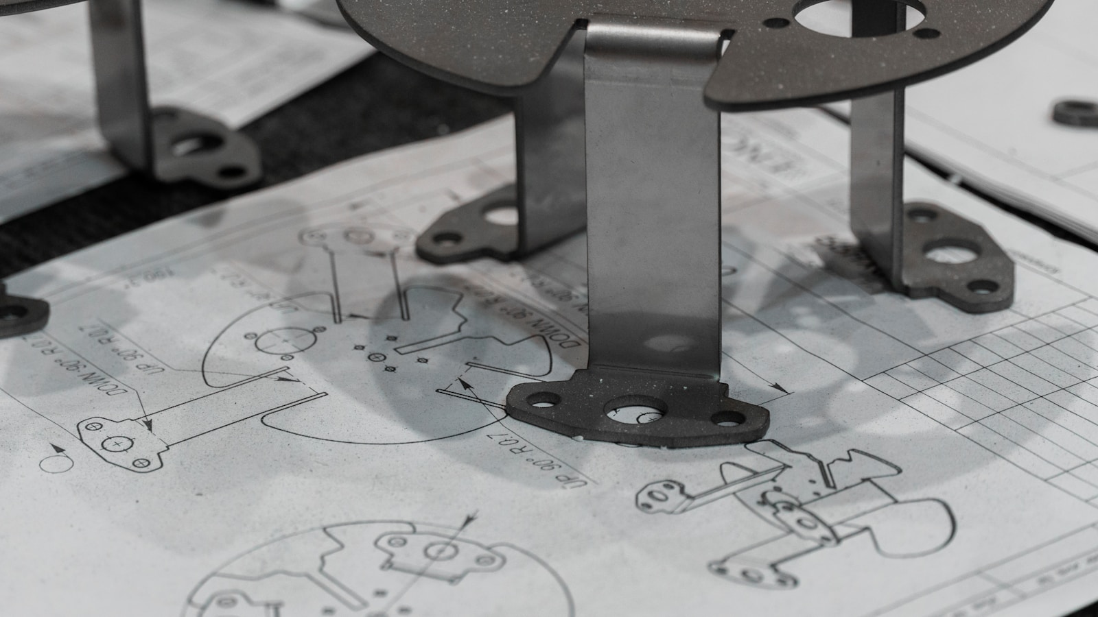 Every detail matters. A manufactured component is verified against its original schematics, ensuring perfect adherence to the design intent. https://www.encata.net/services/mechanical-engineering-services?utm_source=unsplash&utm_medium=organic&utm_content=image
