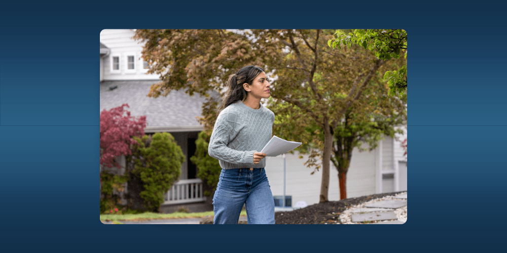 Process server approaching house with legal documents