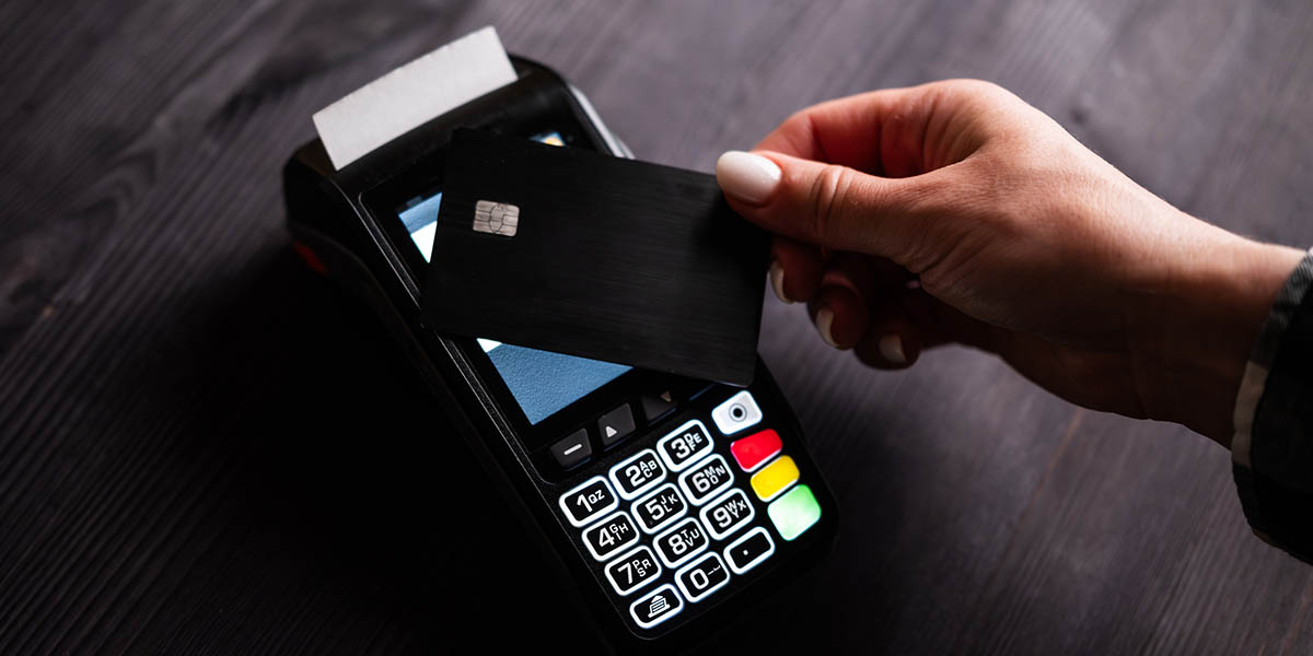 Girl Paying By Credit Card With Wireless Pos Terminal