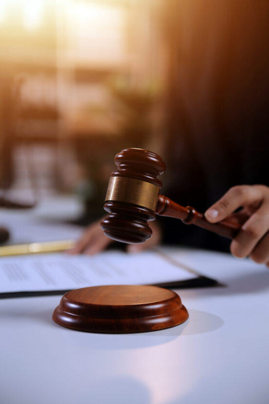 Law theme, gavel or mallet of the judge, lawyer enforcement officers, evidence-based cases taken into account in the court abount business, legislation.