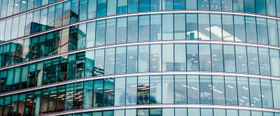 https-esquireglobalcrossings-squirepattonboggsblogs-com-wp-content-uploads-sites-21-2026-08-business-image-background-with-corporate-offices_adobestock_381349355-jpg