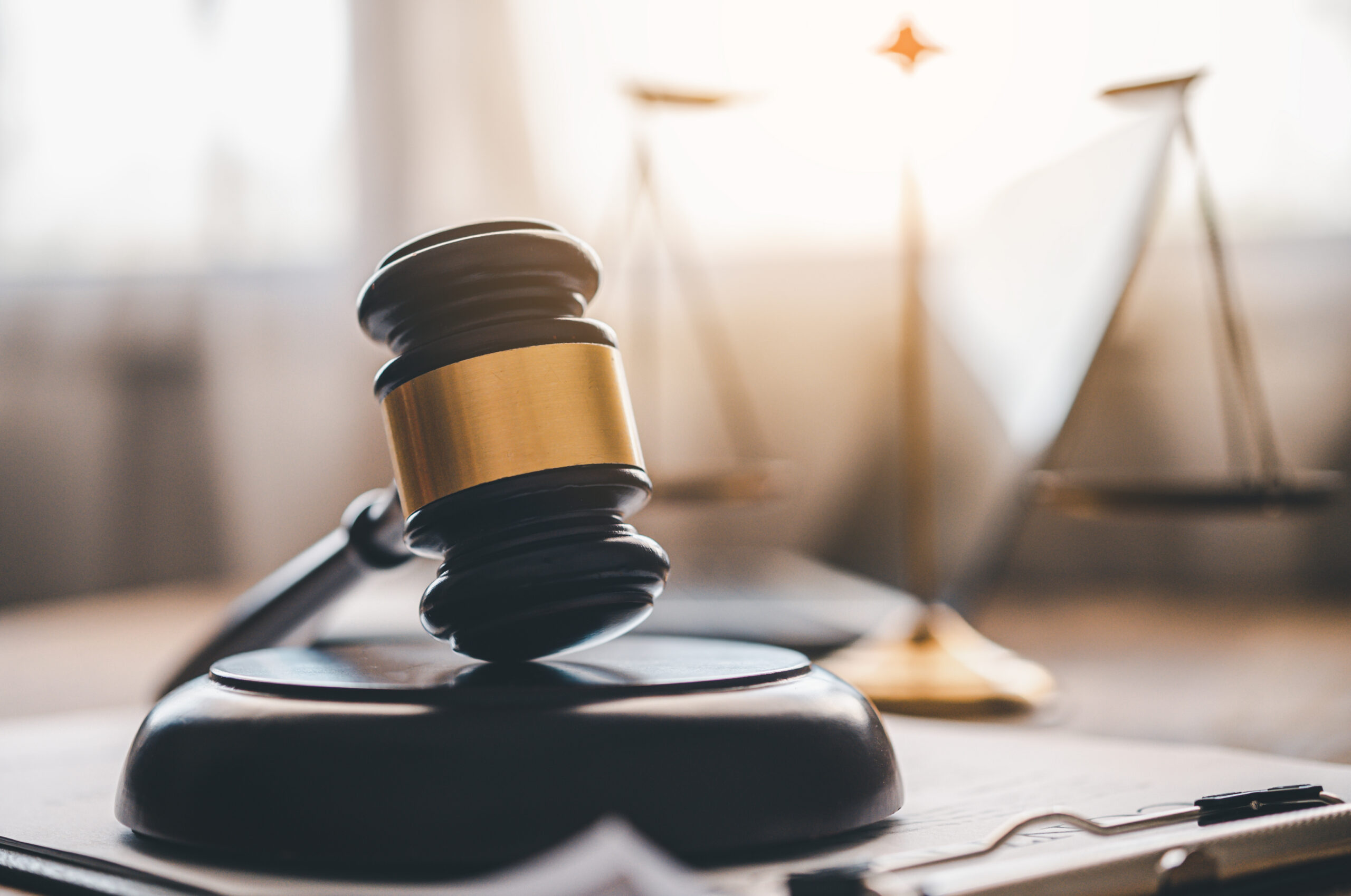 Law theme, mallet of the judge, law enforcement officers, evidence-based cases and documents taken into account