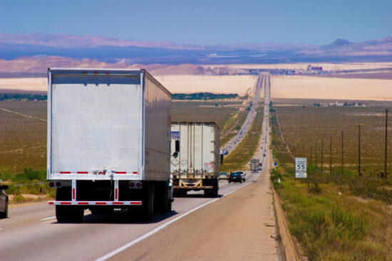 interstate delivery trucks on a highway