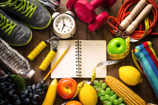 https-www-employmentlawworldview-com-wp-content-uploads-sites-13-2026-09-high-angle-view-of-various-fruits-with-exercise-equipment-on-table-gettyimages-1084671586-jpg