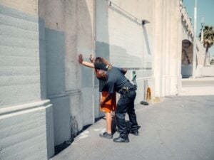 Search Incident to a Lawful Arrest: What Police Can and Cannot Do 3 A police officer patting down a suspect during a lawful arrest on a Los Angeles street
