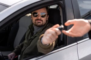 https-kirakosianlaw-com-wp-content-uploads-2026-08-side-view-man-driving-car-300x200-jpg